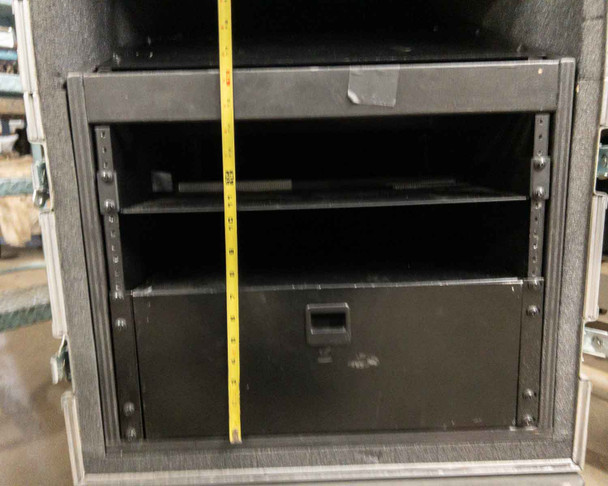 Interior view of Kent Custom Cases 8U rack section with measurement tape showing rack rail height and pull-out drawer below