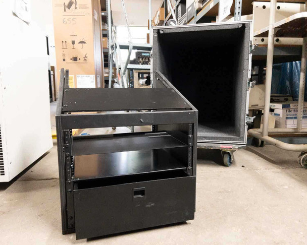 Kent Custom Cases 8U ATA road case partially disassembled in warehouse showing rack core with drawer and detached outer shell