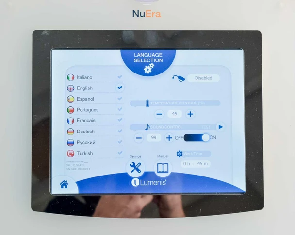 Lumenis NuEra Tight touchscreen language selection screen showing service hours: 0h 45m total use time