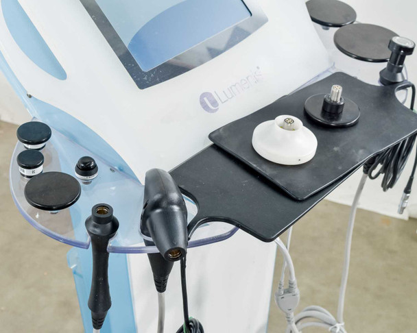 Lumenis NuEra Tight handset arm close-up showing BiPolar handsets, black RF discs, and coaxial connectors