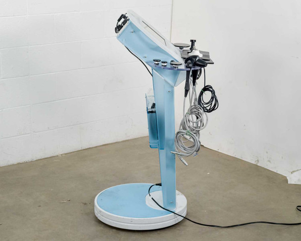 Lumenis NuEra Tight side profile view showing cart arm, blue chassis column, and circular base on right side