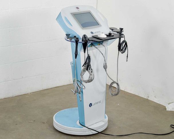 Lumenis NuEra Tight three-quarter angle view showing full system with all handsets, cables, and touchscreen console