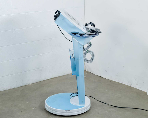 Lumenis NuEra Tight – right side view showing cart profile, accessory arm, grounding pad cable, and circular base