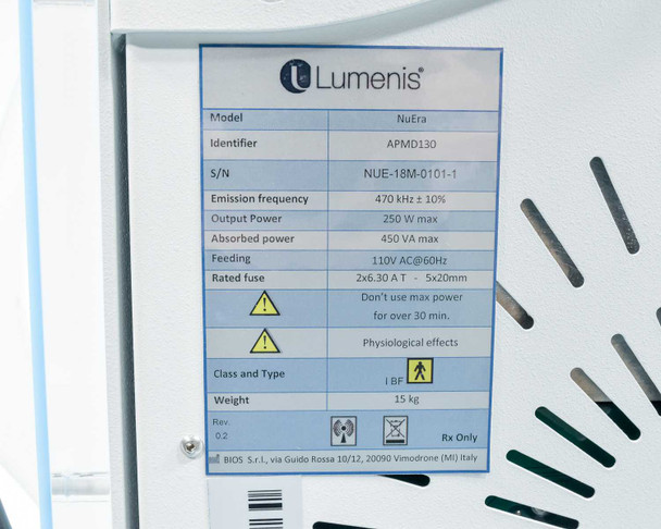 Lumenis NuEra APMD130 specification label showing 470kHz emission frequency, 250W output, 110V AC 60Hz, serial number, and Rev 0.2