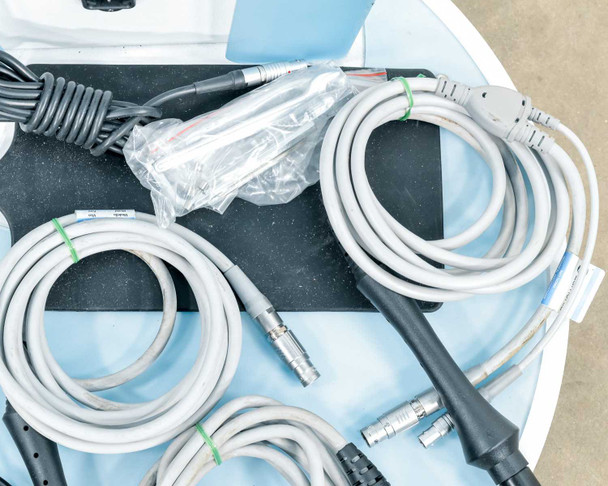 Lumenis NuEra Tight handsets and cables on black storage insert showing multiple gray cables and handset connectors