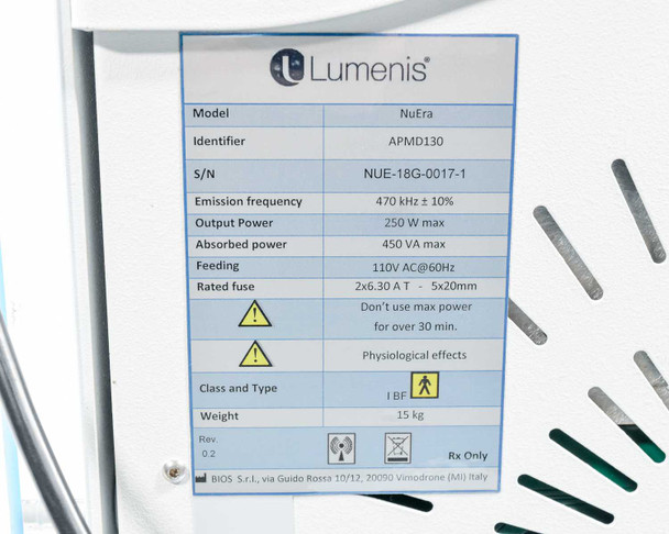 Lumenis NuEra Tight specification label showing model APMD130, 470kHz, 250W, 110V AC 60Hz, Rev 0.2