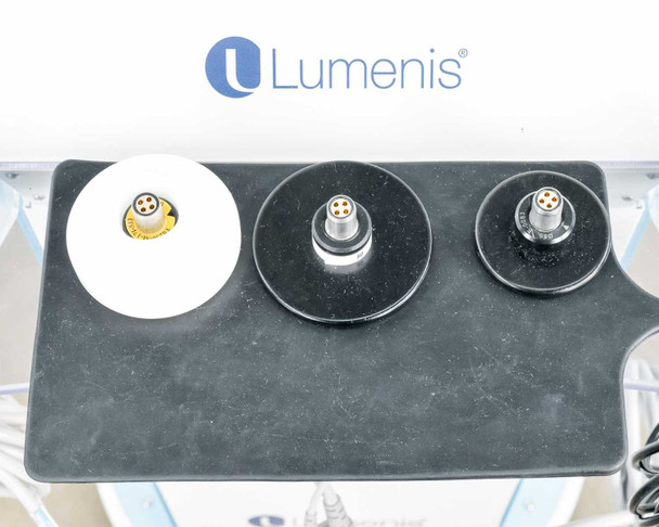 Lumenis NuEra Tight handset connector tray showing one white and two black handset bases with multi-pin connectors