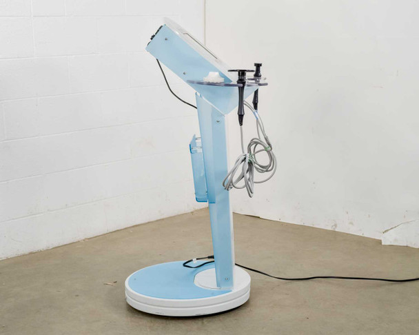 Lumenis NuEra Tight – right side profile view showing unit tilted, blue column, circular base, handset and power cables