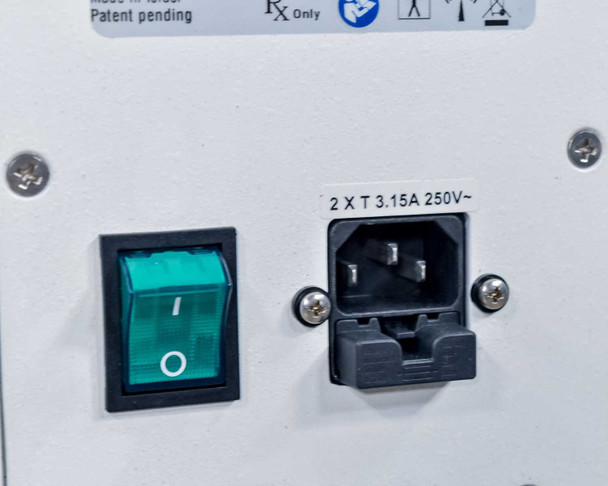 Lumenis Legend Pro rear panel close-up showing power switch (illuminated green) and IEC C14 inlet with 2 x T 3.15A 250V fuse holder