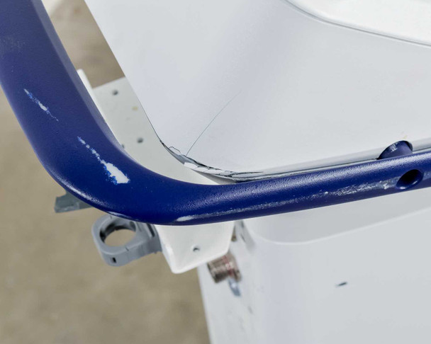 Pollogen Legend+ upper handle close-up showing paint chips and crack damage on blue handle near screen junction