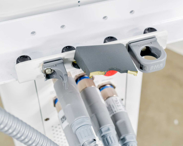 Pollogen Legend+ underside of applicator arm rail showing applicator port connections and PMQ bracket detail
