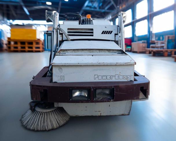 PowerBoss TSS/80-HD — front view showing dual headlights, side broom, front bumper, and PowerBoss logo on body panel