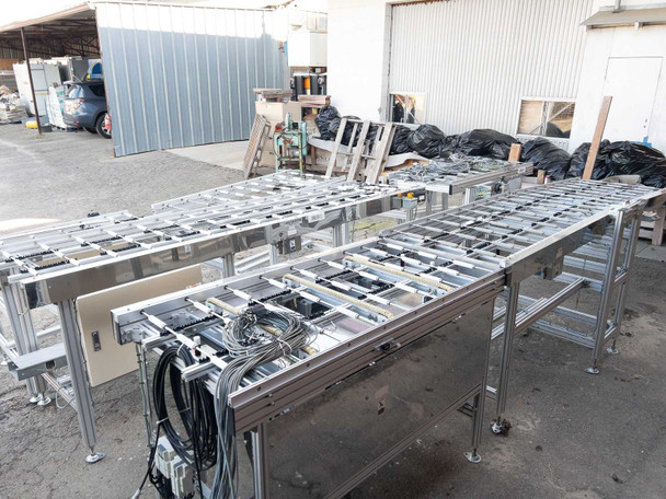 Two Excel Flow SC23460 conveyor sections positioned side by side outdoors – aluminum extrusion frame and roller bed detail