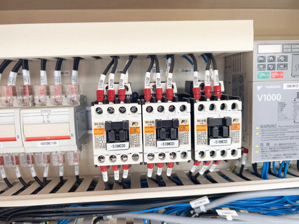 Close-up of three Fuji Electric SC-0/G motor contactors (marked -518MC00, -518MC01, -518MC02) inside control cabinet