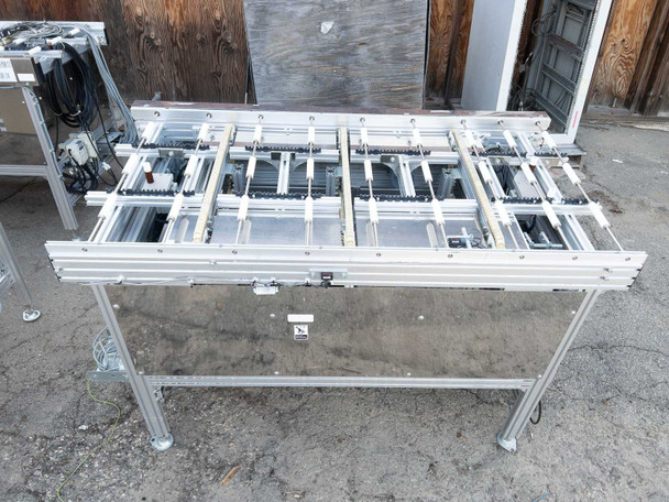 Short Excel Flow SC23460 conveyor section with compact roller bed and motorized drive components visible – front angle