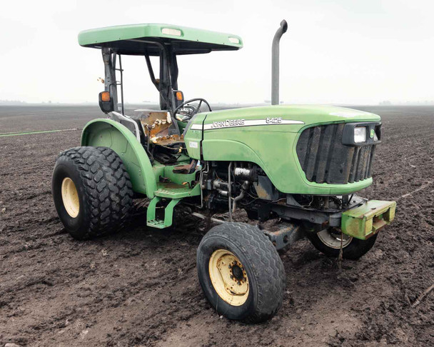 2005 John Deere 5425 65 HP 2WD diesel tractor — 3/4 front view showing open canopy, turf tires, and green hood in field setting