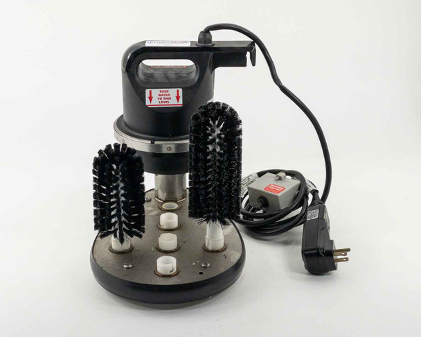 Fisher Scientific FS-100 Labware Washer front view showing motor housing, oval base, two brushes, and foot switch