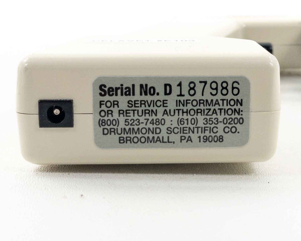 Drummond Pipet-Aid underside label showing Serial No. D187986 and Drummond Scientific Co. Broomall PA contact information with DC power input jack