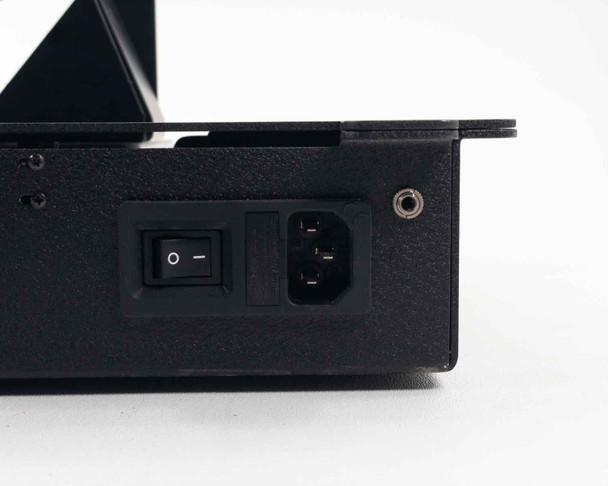 Rear panel of motorized sled base showing rocker power switch, IEC C14 power inlet, and auxiliary connector port
