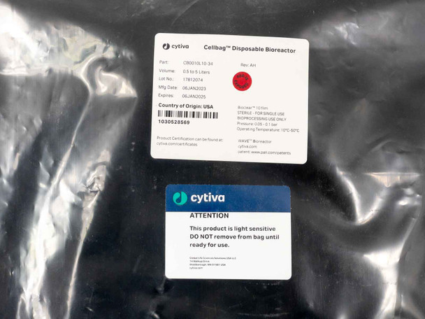 Cytiva Cellbag CB0010L10-34 product label showing part number, lot number, manufacturing and expiration dates, Bioclear 10 specs, and light-sensitive attention notice