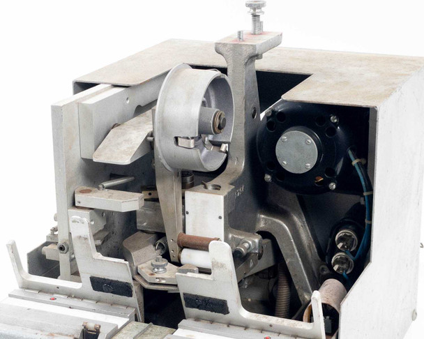 Hollywood Film Company 2816 interior mechanism detail – sprocket wheel, film transport arms, motor, and mechanical linkages