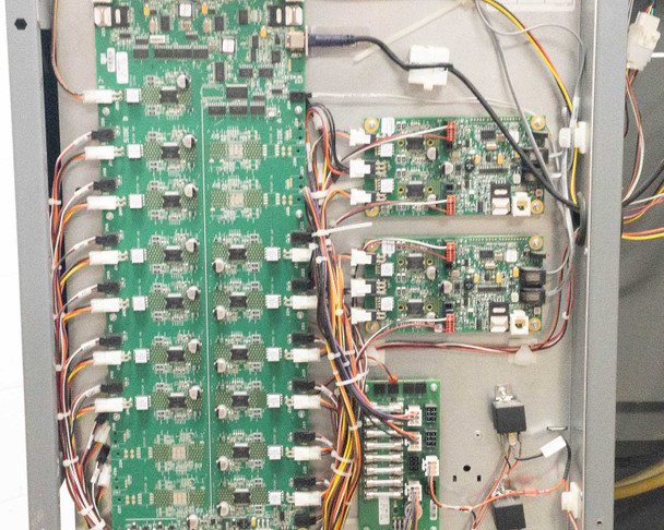 Close-up of Accutinter 1600HS internal control boards showing multiple green PCBs with connectors and wiring harnesses