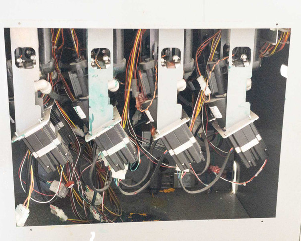 Accutinter 1600HS pump drive assembly – four stepper motors with colorant pump tubing visible on mounting bracket