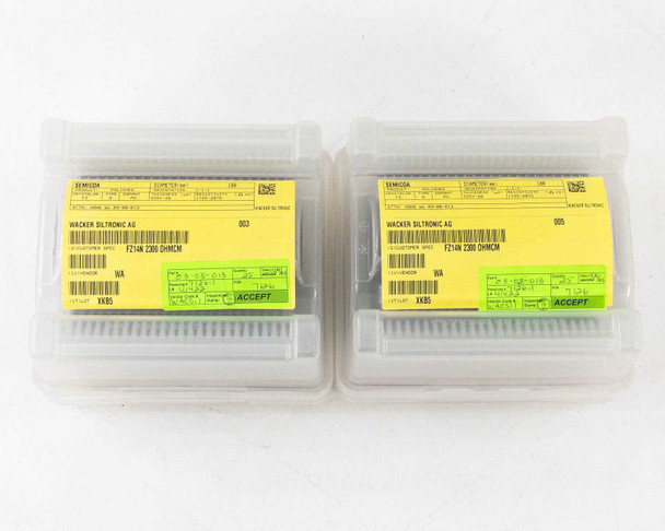 Two Siltronic wafer carriers side by side showing yellow lot labels reading Wacker Siltronic AG FZ214N Z300 OHNCM