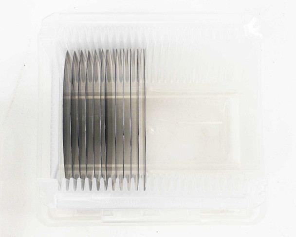MACOM 100mm polished silicon wafers top-down view in open carrier showing pointed flat-edge orientation of N-type silicon substrates