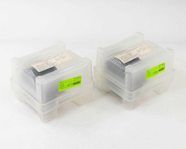 MACOM 100mm polished silicon wafer lots — two closed carrier boxes with paper spec labels and green barcoded inventory stickers on lids