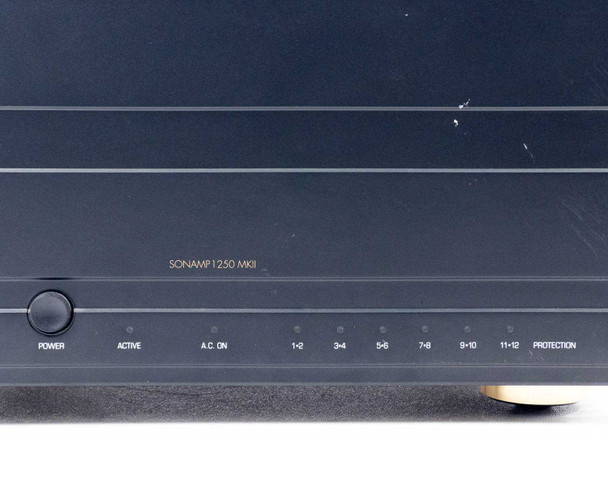 Sonance SONAMP 1250 MKII front panel detail showing full channel indicator row: Power, Active, A.C. On, 1-2, 3-4, 5-6, 7-8, 9-10, 11-12, Protection