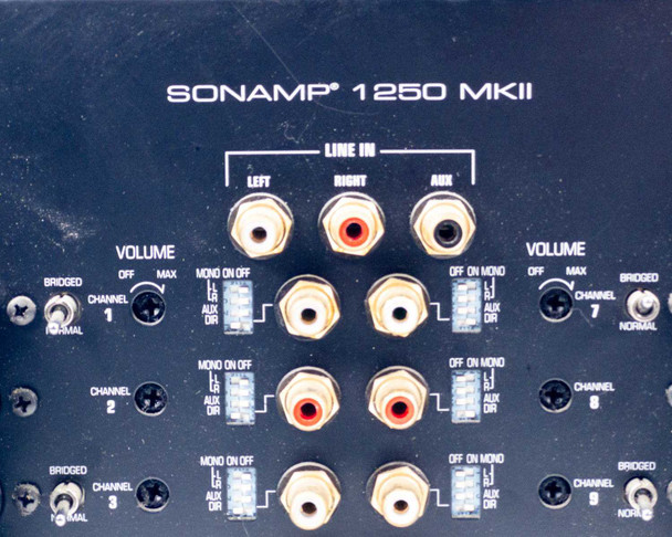 Sonance SONAMP 1250 MKII rear panel upper-left section — Line In RCA inputs and per-channel volume and mono/bridge switches for channels 1, 2, 3, 7, 8, 9