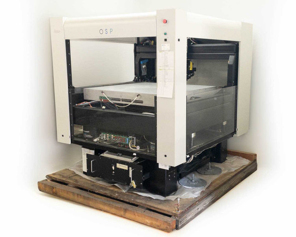 Veeco OSP Overhead Scanning Profiler – three-quarter front-left view showing white gantry enclosure, scan stage, and electronics chassis on wooden pallet