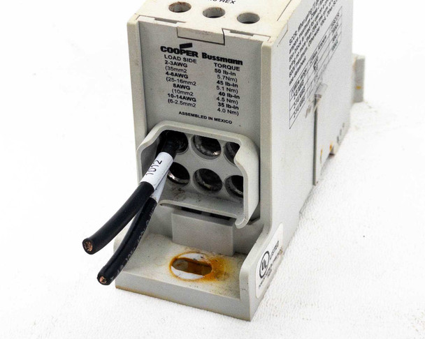 Cooper Bussmann PDBFS330 Cu7 – angled load side view showing terminal openings and attached wires with torque label