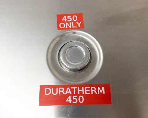 Close-up of Duratherm 450 fluid port on top of Lneya SUNDI-255 with '450 Only' and 'Duratherm 450' labels indicating fluid specification