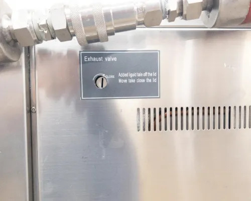 Close-up of top panel exhaust valve labeled 'Exhaust valve / GLOBE' with instructional text for liquid fill and lid operation
