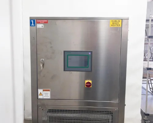 Lneya Sundi-1A15 chiller front view with door closed, Duratherm G-LV and Dublin Body Heater labels visible, touchscreen behind locked panel door with key lock