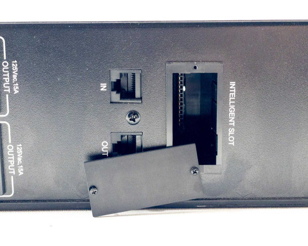 Xtreme Power Conversion V80-1kLi1 – close-up of rear center showing RJ-45 IN and OUT ports and Intelligent Slot expansion bay with cover ajar