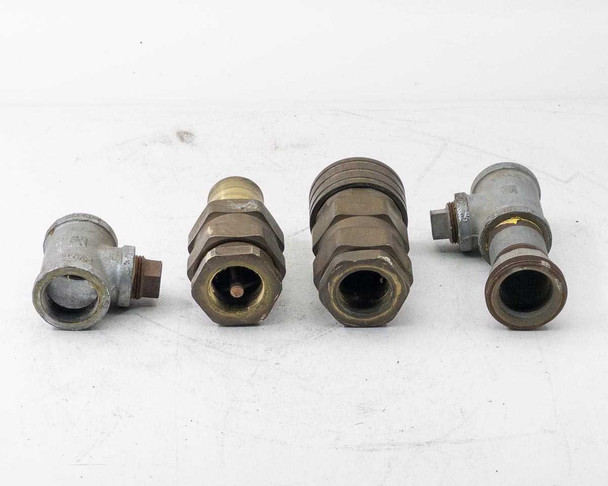 Thermoid Cobra 1.25 in hose couplings — lot of 4, opposite-end view showing hex nuts and bore openings