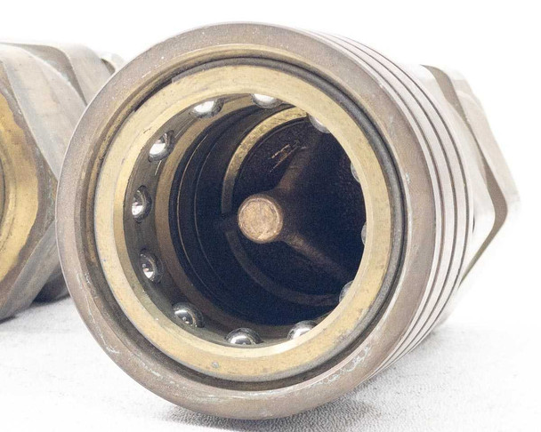 Close-up of large Thermoid Cobra brass hose coupling bore showing internal valve mechanism and sealing ring