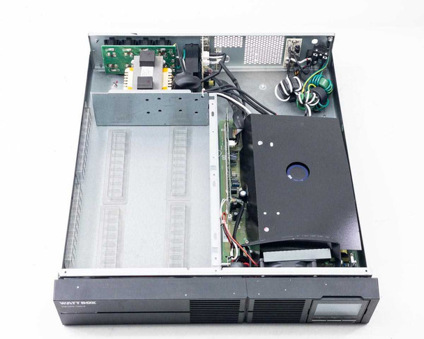WattBox WB-UPS-1500-8 UPS — interior view with top cover removed showing internal PCBs, transformer, wiring harness, and empty battery bay