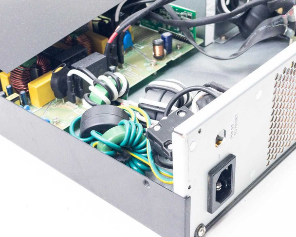 WattBox WB-UPS-1500-8 UPS — interior close-up of power section showing inductors, toroidal coils, wiring, and IEC AC inlet