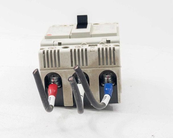Mitsubishi NF125-CW rear-bottom view showing three line-side terminals with color-coded lead wires