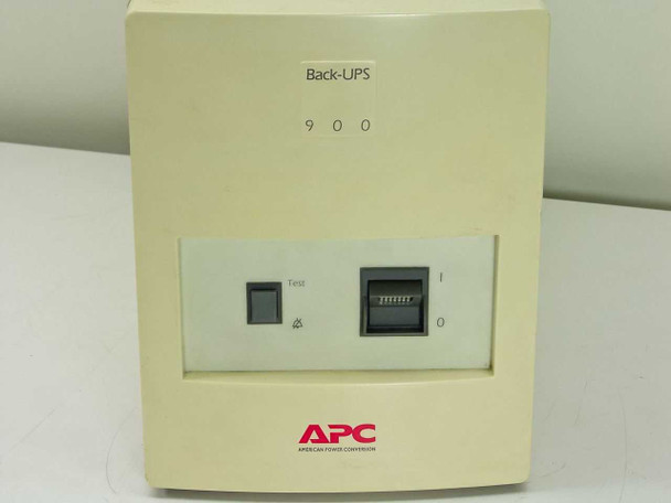 APC Back-UPS 900 front panel close-up showing Test button, I/O power switch, alarm/battery indicator LEDs, and APC American Power Conversion badge