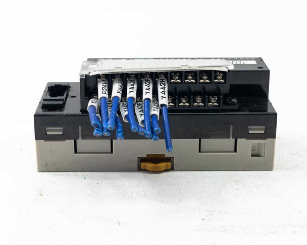 Omron CRT1-ID16 Remote Terminal Input Module – top-angled view showing terminal connections with labeled blue wiring leads installed