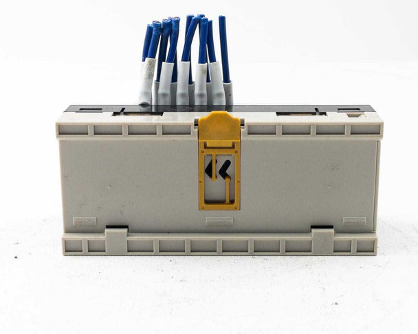 Omron CRT1-ID16 Remote Terminal Input Module – bottom view showing DIN rail mounting clip and yellow latch release lever