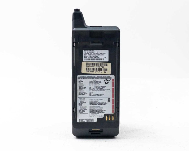 Motorola DPC550 rear view showing full back label with FCC ID, model number 34015WNR5A, MSN, barcode stickers, and operation reference card