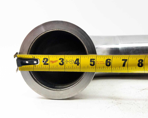 SS 304 vacuum 90-degree elbow pipe – straight-leg end-on measurement view confirming approx. 4-inch bore diameter with Milwaukee tape measure