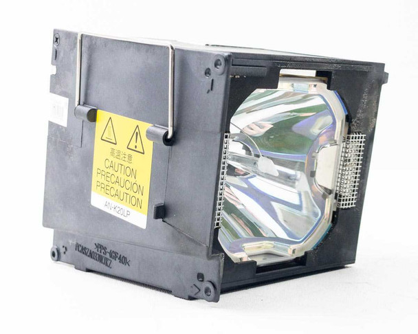 Sharp AN-K20LP projector lamp module — left-side view showing yellow caution label and AN-K20LP part number printed on housing