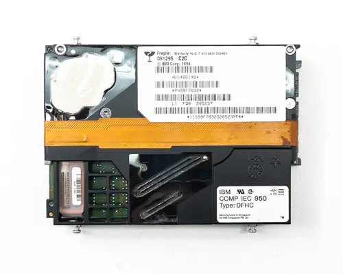 IBM 99F7832 hard drive top label view showing IBM Corp 1994 copyright, part number, and IEC 950 Type DFHC compliance label